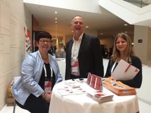 Eva E. Aldrich, M.A., CFRE (at left) with Arne Peper (center), CEO of the German Fundraising Association